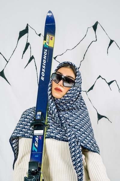 downhill skis, alpine skis, racing skis, winter sports gear, skiing equipment, brand awareness, editorial, lifestyle, luxurious, bold, blue, neutral